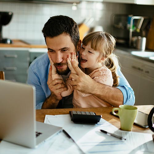 Father and daughter paying the bills