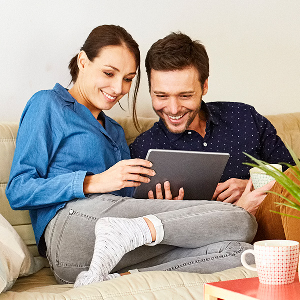 couple smiling while reading