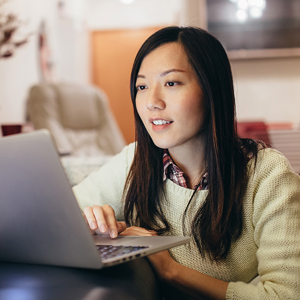 woman looking at laptop