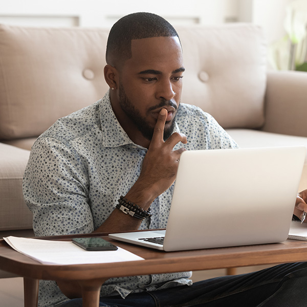 man looking at laptop