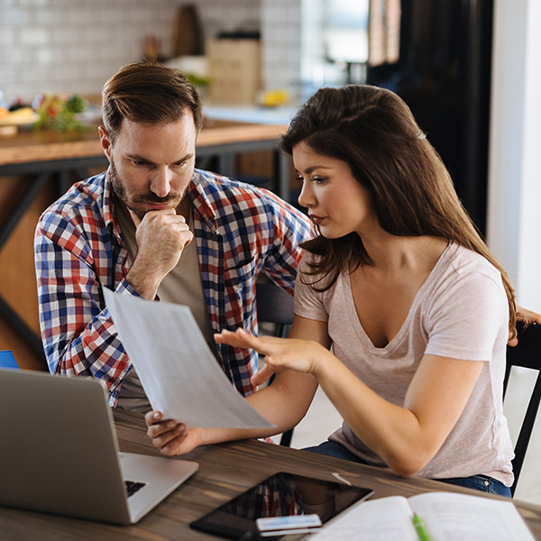 couple reading paperwork